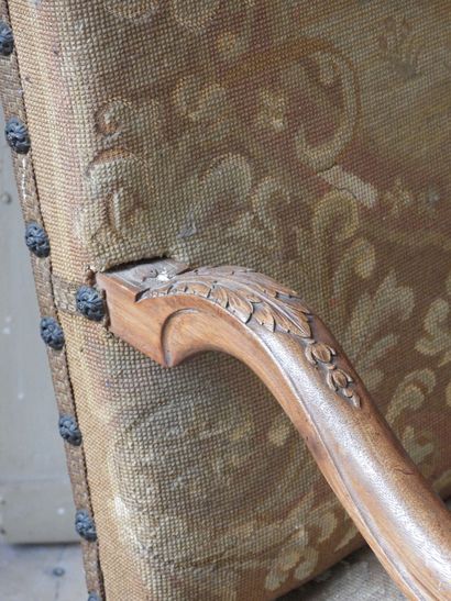 Regency style armchair in natural wood resting...