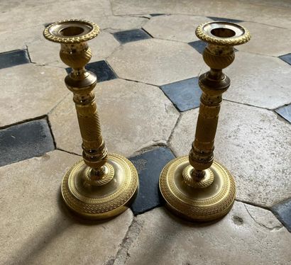 Pair of gilt bronze candlesticks with chased...