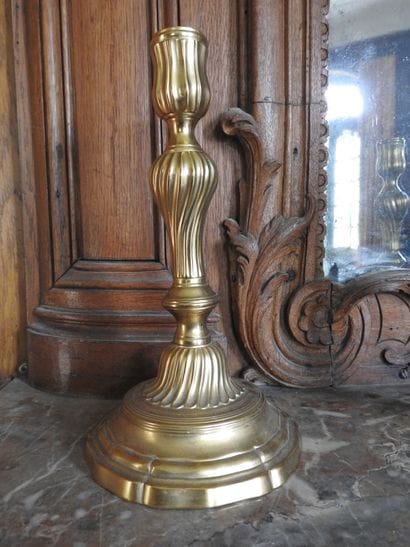 Pair of ormolu torches with torso shaft....