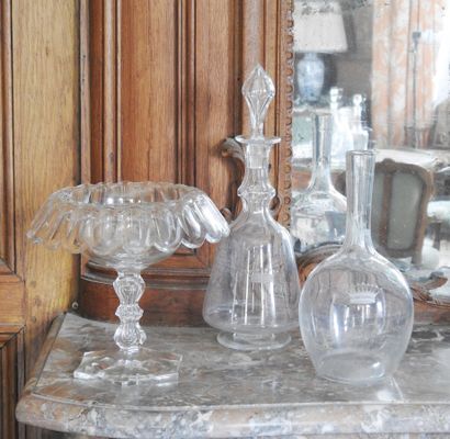 Meeting of two crystal decanters with engraved...