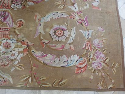 Large Aubusson carpet, the brown field decorated...