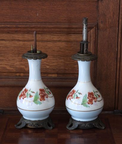 Pair of porcelain oil lamps with polychrome...