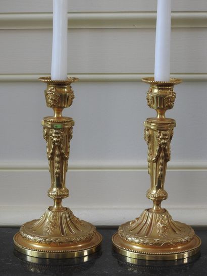 Pair of ormolu torches decorated with garlands...