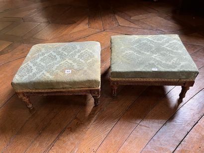 Pair of carved molded wood footrests resting...