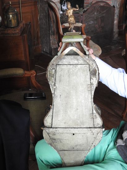 Cartel with bell and its base of lamp out...