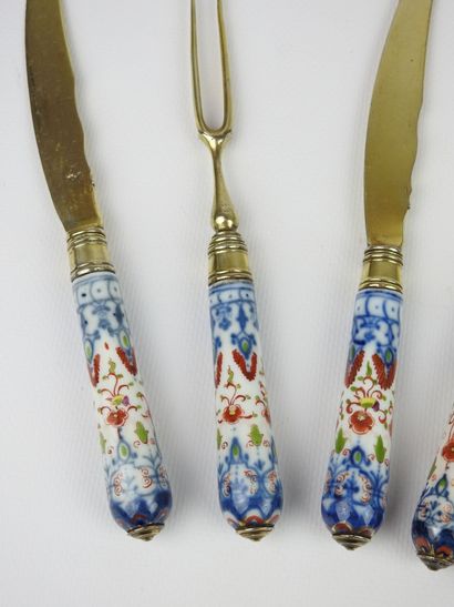 Set of three knives and two forks with two...