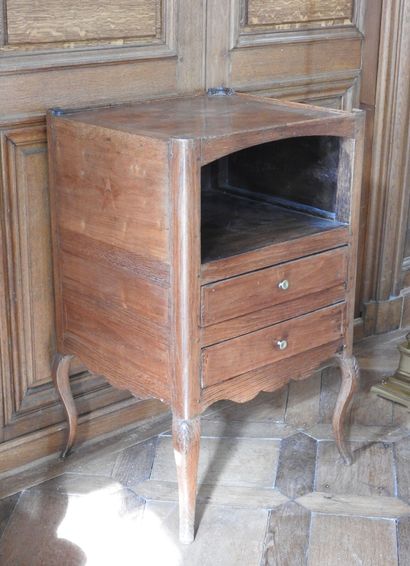 An oak table with an inlaid top forming a...