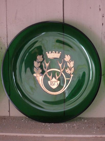 Suite of three green tinted crystal cups...