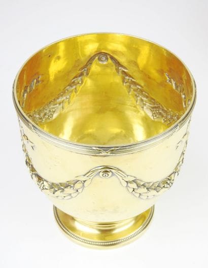 Pair of gilt Minerva silver coolers resting...