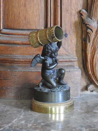 A patinated and gilded bronze match holder...