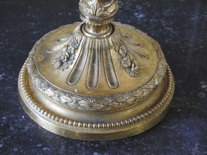 Pair of ormolu torches decorated with garlands...