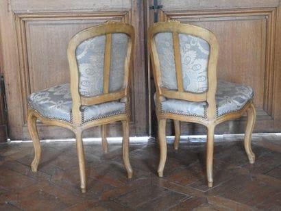 Pair of chairs in natural wood, molded and...