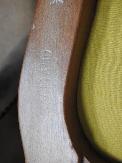 Pair of armchairs in natural wood molded...