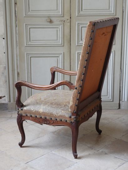 Regency style armchair in natural wood resting...