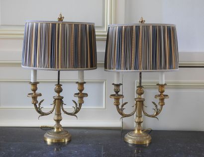 Pair of Louis XVI style candlesticks in chased...