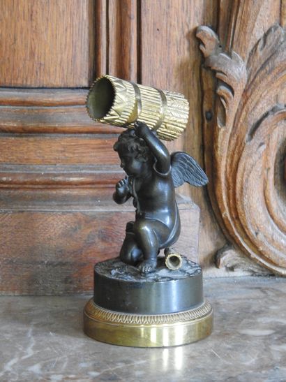 A patinated and gilded bronze match holder...