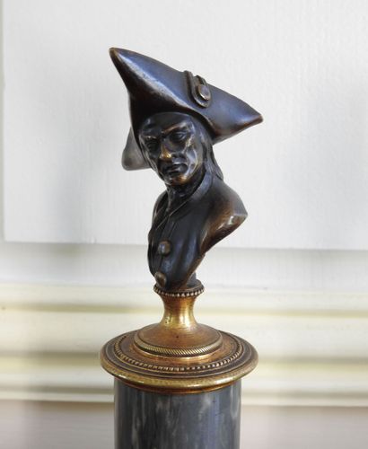 Pair of bronze busts with brown patina representing...