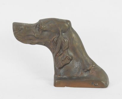 BUST of a dog in bronze, signed RM. 13 x...