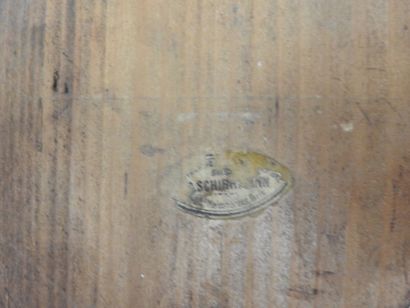 Carved wood wall clock decorated with an...