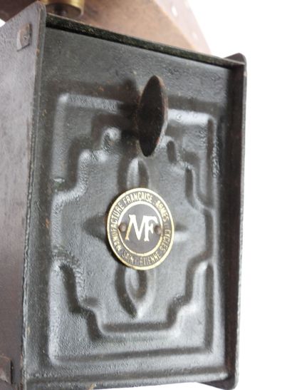 Wood and metal mirror. Mechanical winding...