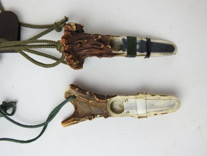 TWO DEER HOLDERS made of antlers. With cases....