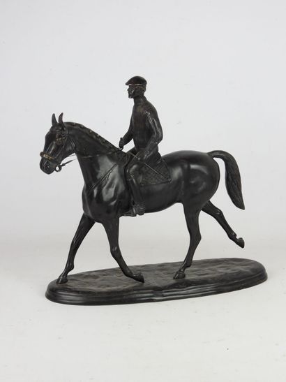 RIDER ON HORSEBACK. Bronze group with brown...