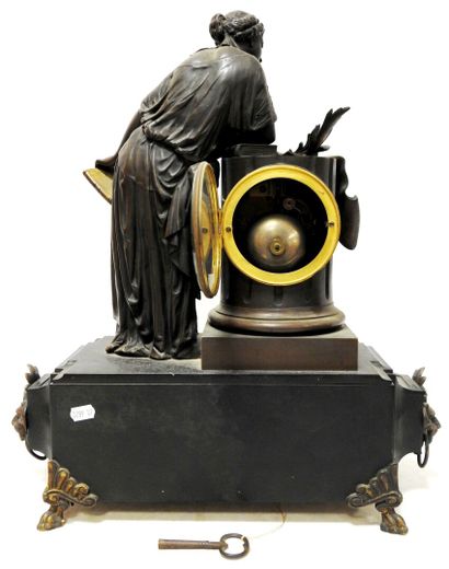 Bronze clock with brown patina representing...