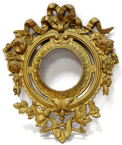 A gilt bronze frame for a cartel decorated...