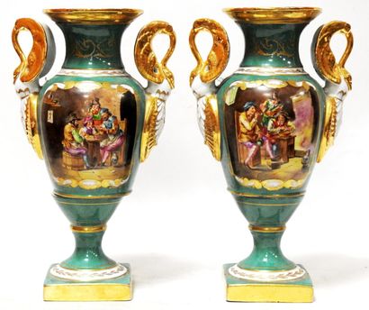 Pair of porcelain vases on a green background...