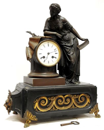 Bronze clock with brown patina representing...