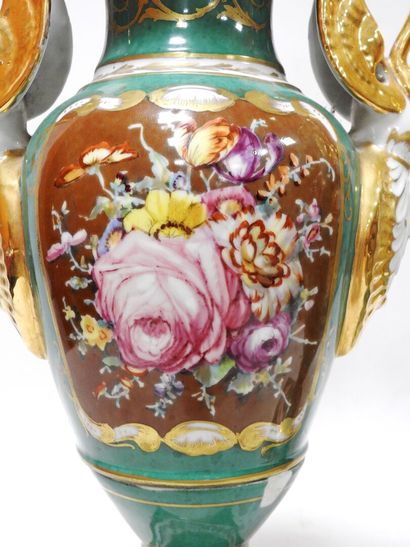 Pair of porcelain vases on a green background...