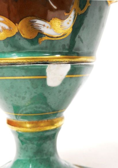 Pair of porcelain vases on a green background...