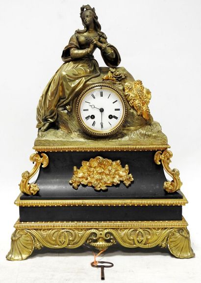 Clock in gilded bronze and patinated bronze...