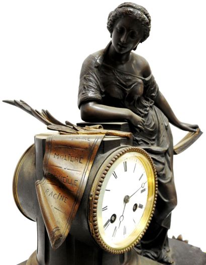Bronze clock with brown patina representing...