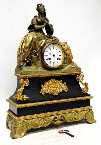 Clock in gilded bronze and patinated bronze...
