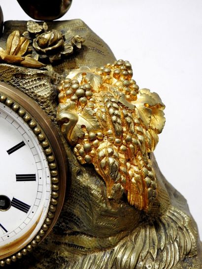 Clock in gilded bronze and patinated bronze...