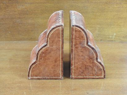 Pair of bookends in leather decorated with...