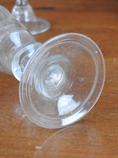 Suite of FOURTEEN GLASSES on foot in blown...