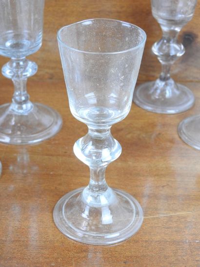 Suite of FOURTEEN GLASSES on foot in blown...