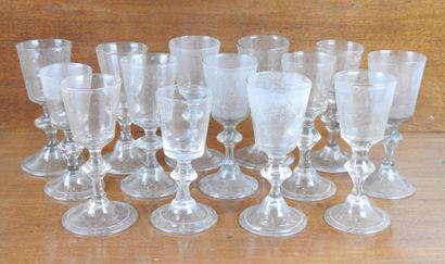 Suite of FOURTEEN GLASSES on foot in blown...