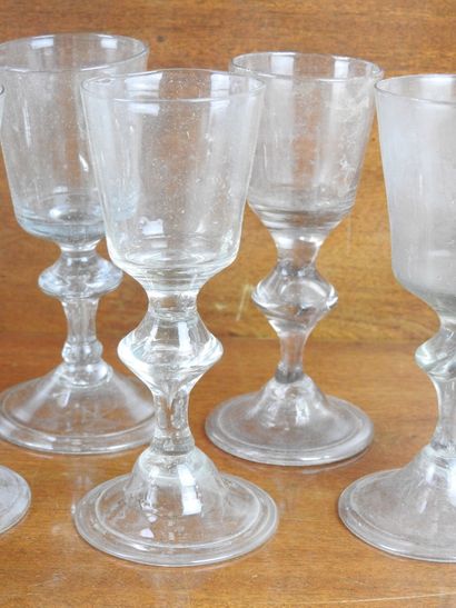Suite of FOURTEEN GLASSES on foot in blown...