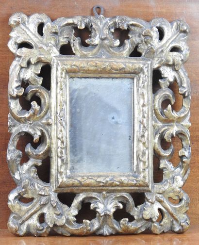 SMALL MIRROR in carved and gilded wood of...