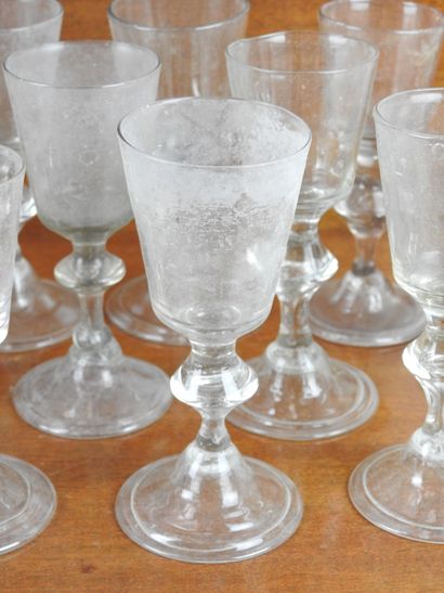 Suite of FOURTEEN GLASSES on foot in blown...