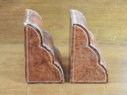 Pair of bookends in leather decorated with...