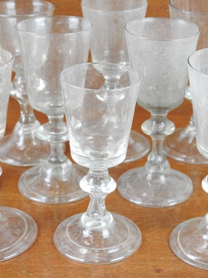Suite of FOURTEEN GLASSES on foot in blown...