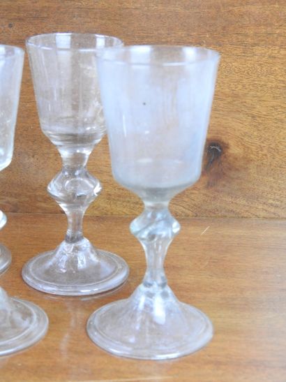 Suite of FOURTEEN GLASSES on foot in blown...