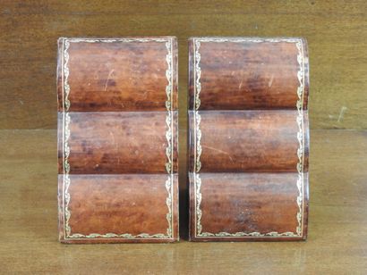 Pair of bookends in leather decorated with...