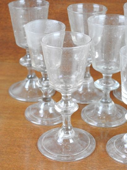 Suite of FOURTEEN GLASSES on foot in blown...