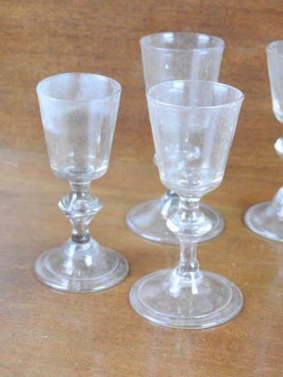 Suite of FOURTEEN GLASSES on foot in blown...