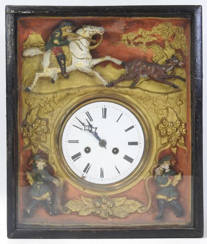 Pendule à décor de chasse et de chasseur,...